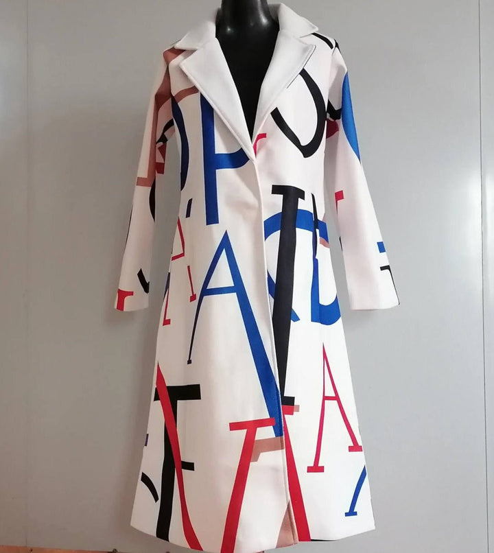 Emma: Oversize wool coat in cream with statement lettering